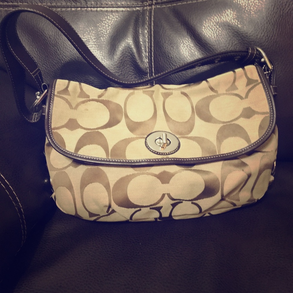 Gently used brown Coach shoulder bag.